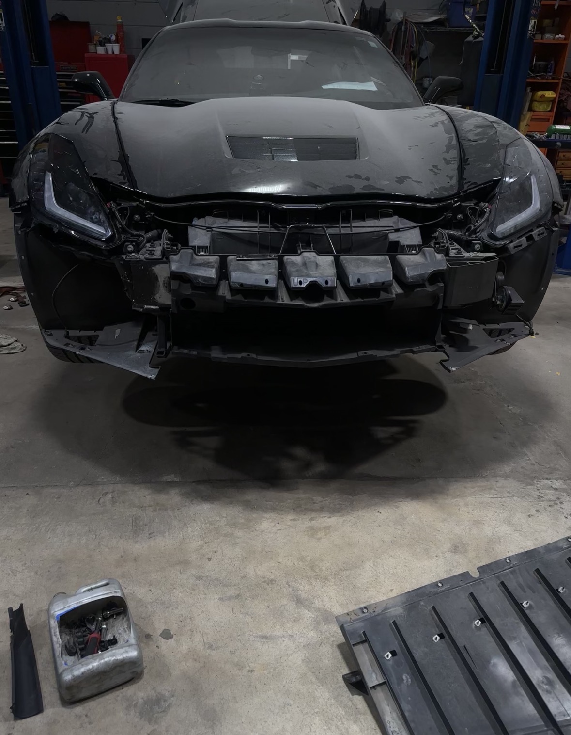 Black Corvette before repair